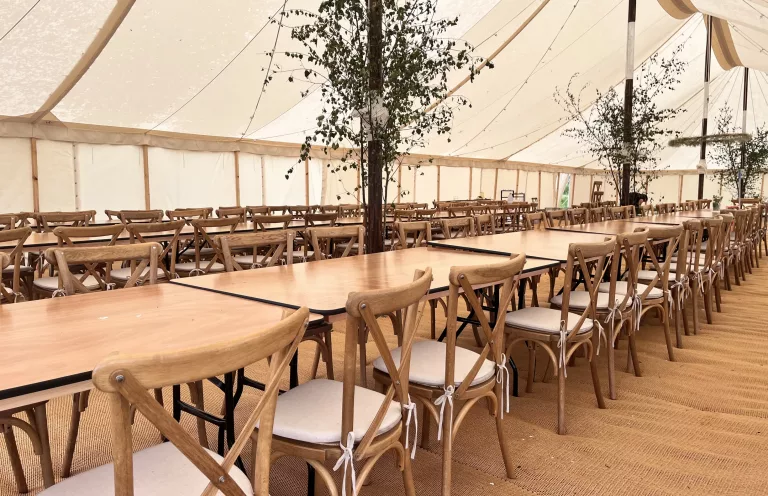 Marquee wedding furniture with oak crossbacks and a rustic charm
